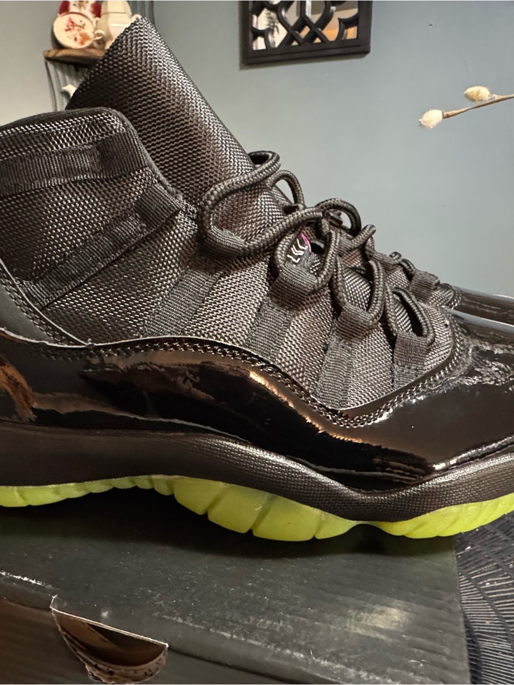 Air Jordan 11 Retro Black Patent High-Top Sneaker with Lime Green Sole